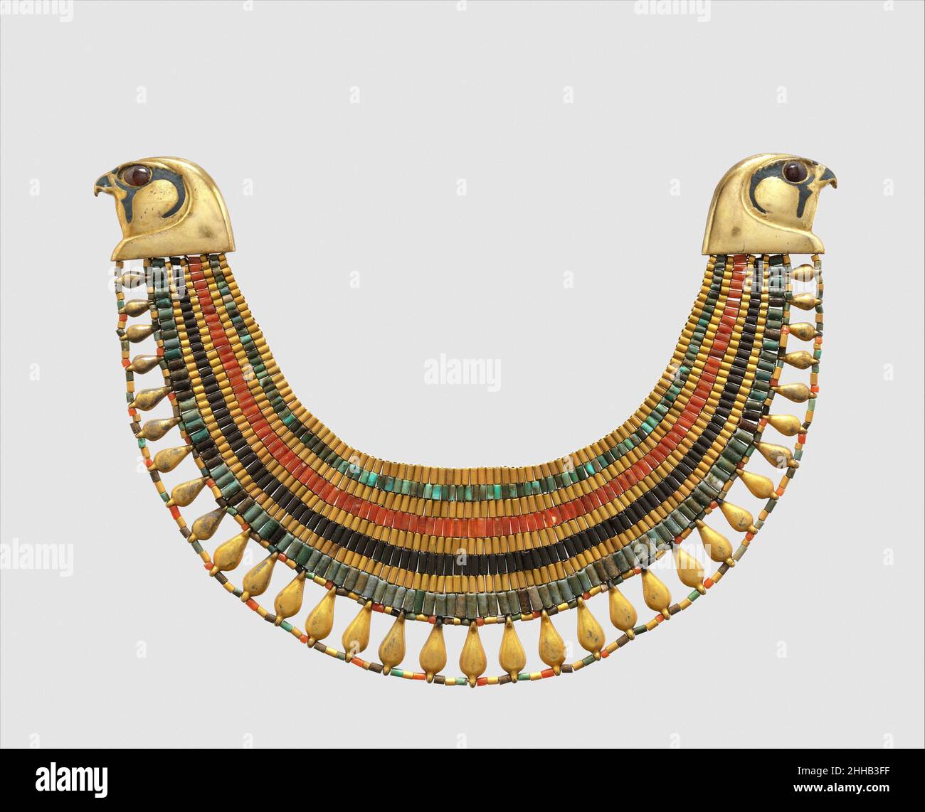 Broad collar of Senebtisi ca. 1850–1775 B.C. Middle Kingdom. Broad collar of Senebtisi. ca. 1850–1775 B.C.. Faience, gold, carnelian, turquoise.Falcon heads and leaf pendants originally gilded plaster, restored in gilded silver. Eyes originally gilded beads restored in gilded plaster.. Middle Kingdom. From Egypt, Memphite Region, Lisht North, Tomb of Senwosret (758), Pit 763, burial of Senebtisi, MMA excavations, 1906–07. Dynasty 12, late–early 13 Stock Photo