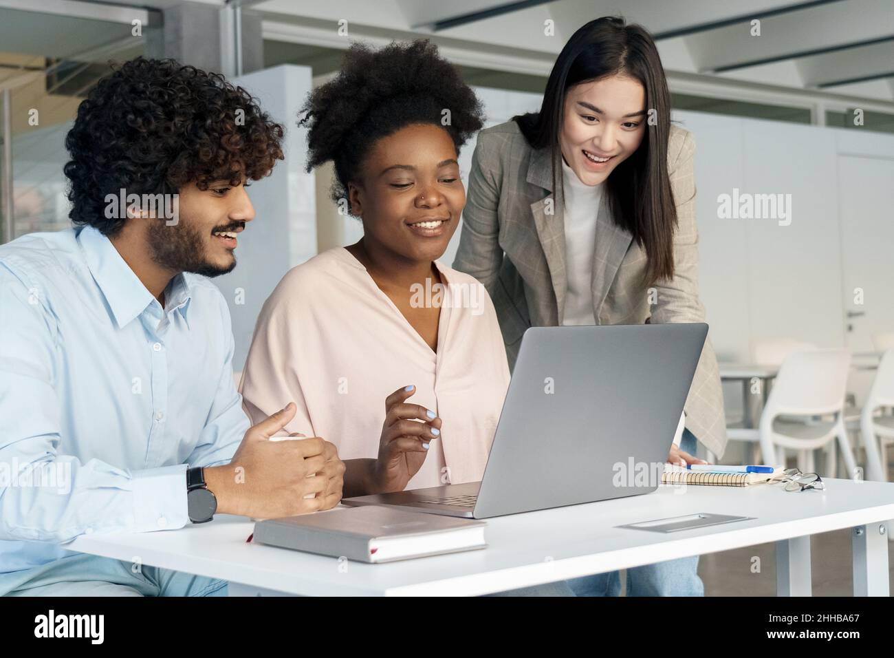 Student diverse people group working or learning together using laptop Stock Photo