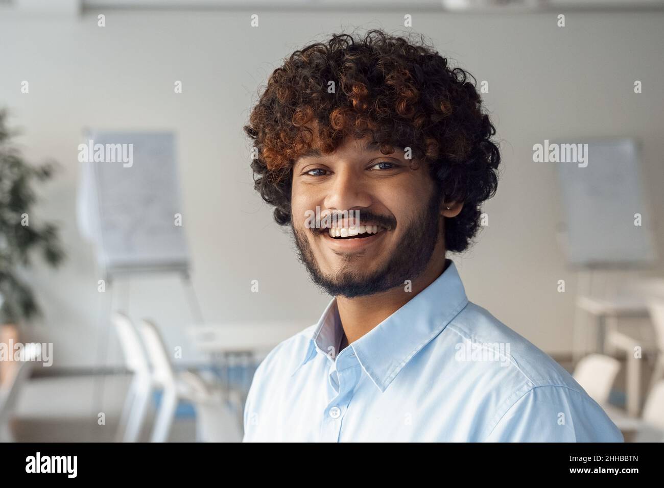 Portrait of happy indian business man with smile face looking at camera Stock Photo