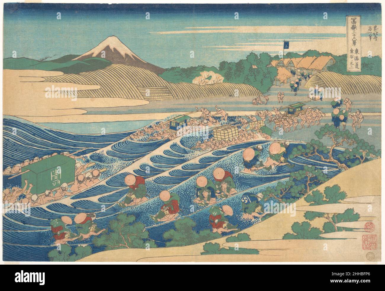 Fuji Seen from Kanaya on the Tōkaidō (Tōkaidō Kanaya no Fuji), from the series Thirty-six Views of Mount Fuji (Fugaku sanjūrokkei) ca. 1830–32 Katsushika Hokusai Japanese The vibrant, stylized design of this print, particularly the turbulent play of color and line used to compose the river and the travelers crossing it, threatens the integrity of the monochrome mountain beyond. The rhyming and analogizing of form and color that figure so prominently in Hokusai's style are virtually absent from this image of explosive color and line.. Fuji Seen from Kanaya on the Tōkaidō (Tōkaidō Kanaya no Fuji Stock Photo