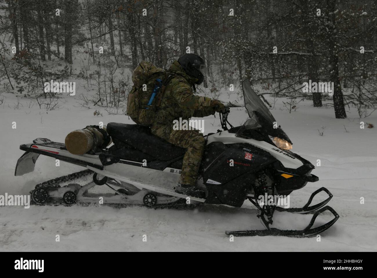 U.S. Army Soldiers from the 20th Special Forces Group, Massachusetts Army National Guard, conduct snowmobile training during Northern Strike 22-1, at Camp Grayling, Mich., Jan. 22, 2022. The winter iteration of the Northern Strike exercise series, known as “Winter Strike,” is held annually in northern Michigan during the coldest part of the year, so visiting units can train in subarctic conditions. (U.S. Air National Guard photo by Staff Sgt. Tristan D. Viglianco) Stock Photo
