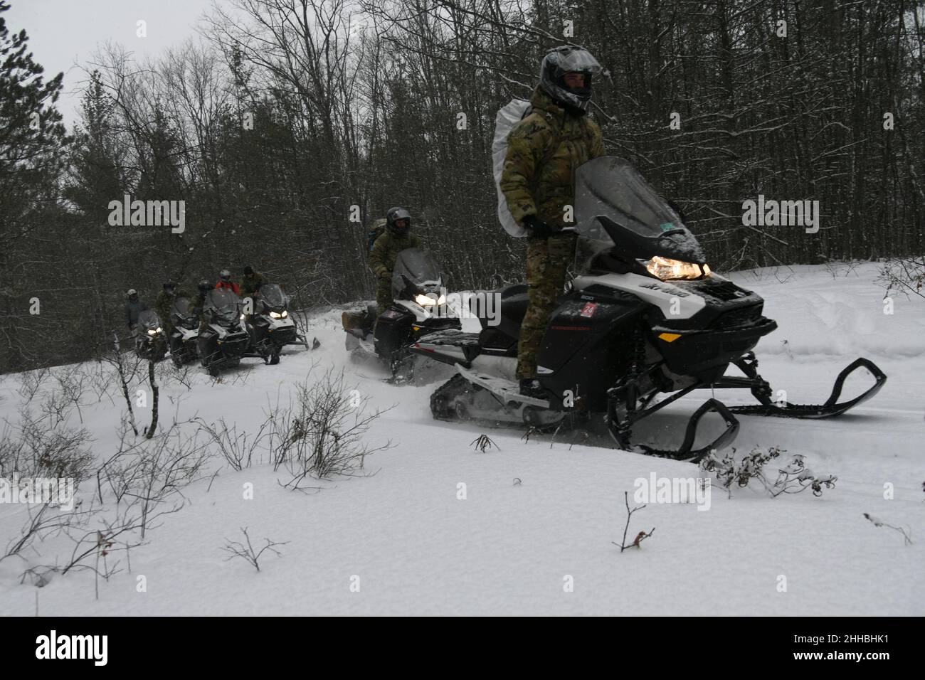U.S. Army Soldiers from the 20th Special Forces Group, Massachusetts Army National Guard, conduct snowmobile training during Northern Strike 22-1, at Camp Grayling, Mich., Jan. 22, 2022. The winter iteration of the Northern Strike exercise series, known as “Winter Strike,” is held annually in northern Michigan during the coldest part of the year, so visiting units can train in subarctic conditions. (U.S. Air National Guard photo by Staff Sgt. Tristan D. Viglianco) Stock Photo