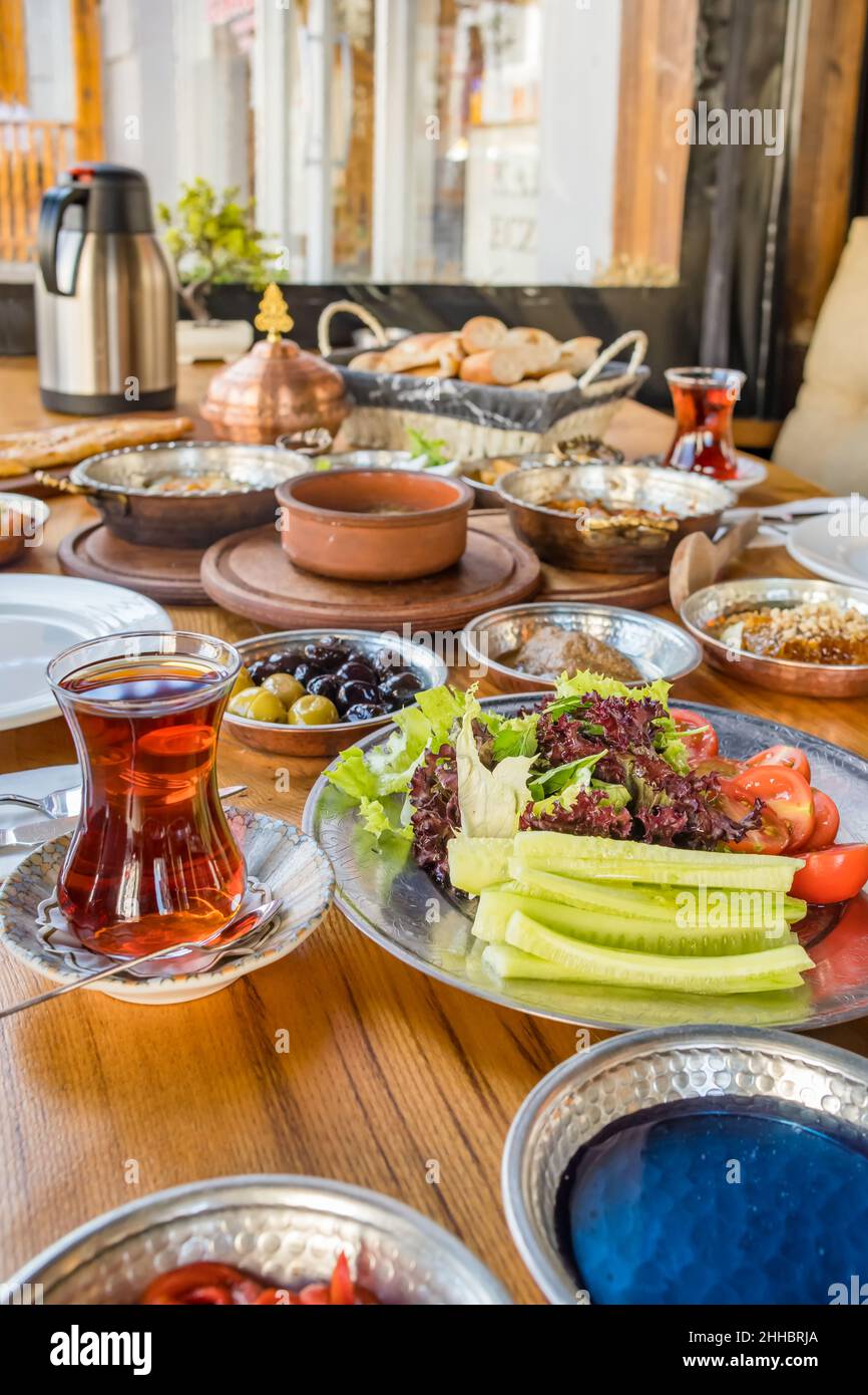 Traditional rich Turkish village breakfast on the wooden table Stock Photo