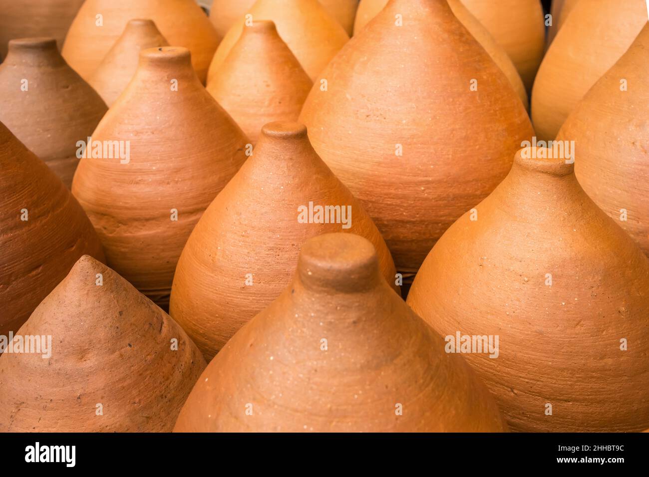 Many clay pots in the pottery workshop close-up Stock Photo