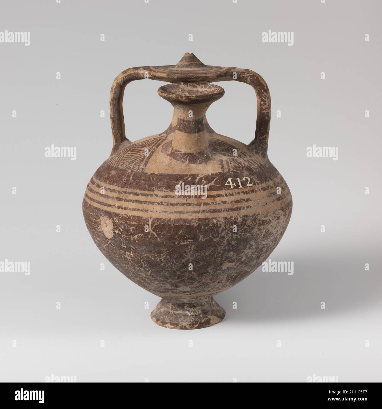 Terracotta stirrup jar ca. 1075–1050 B.C. Cypriot Proto-white painted ware with bands and triangles.. Terracotta stirrup jar  240356 Stock Photo