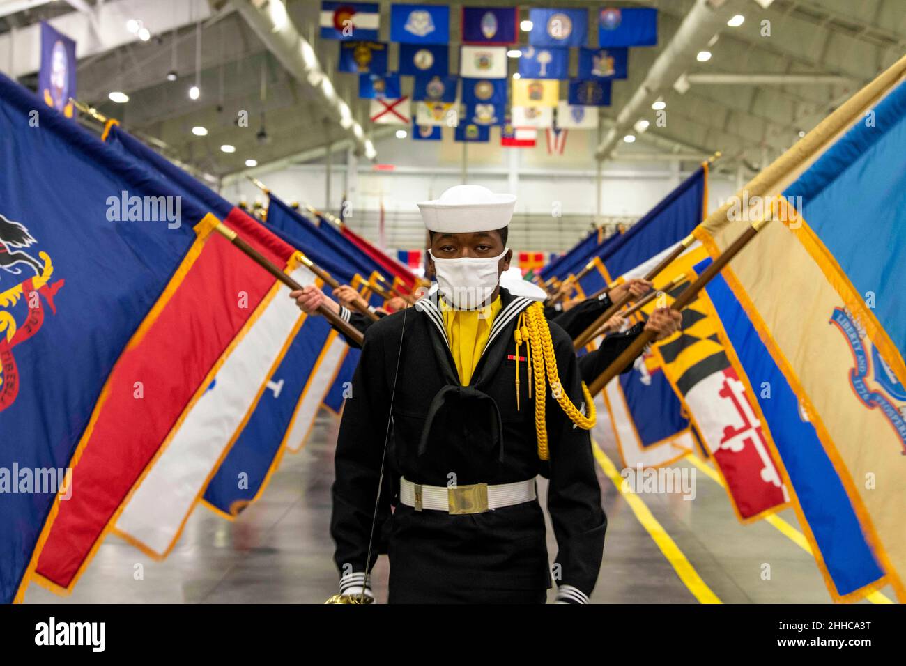 Great Lakes, llinois, USA. 14th Jan, 2022. Sailors graduating from boot camp march in Midway Ceremonial Drill Hall during a pass-in-review graduation ceremony at Recruit Training Command. More than 40,000 recruits train annually at the Navy's only boot camp. Credit: U.S. Navy/ZUMA Press Wire Service/ZUMAPRESS.com/Alamy Live News Stock Photo