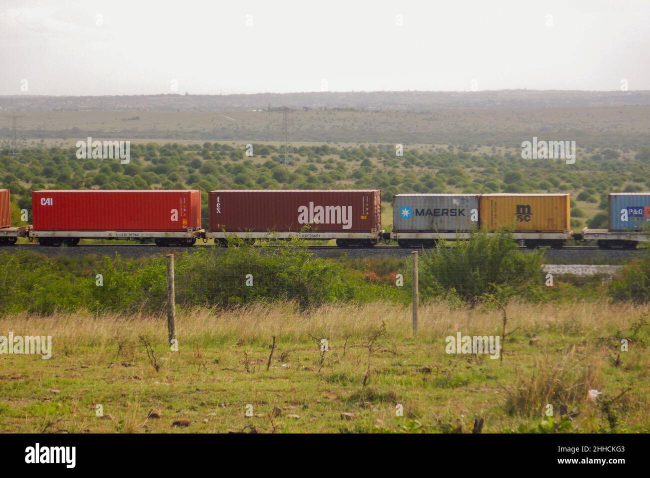 Cargo train on the Nairobi Mombasa Railway seen from Nairobi National Park, Kenya Stock Photo