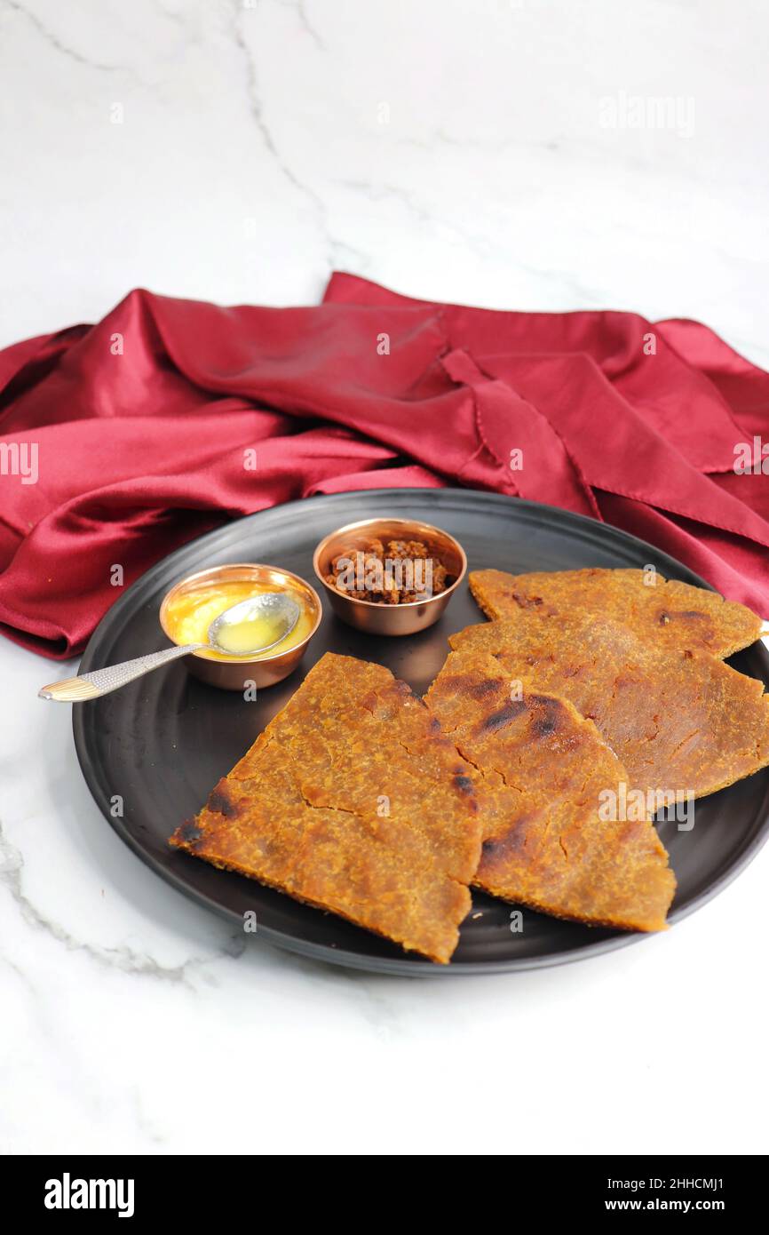 Sweet roti made out of rice flour, jaggery, and ghee. Gud ki roti. gur