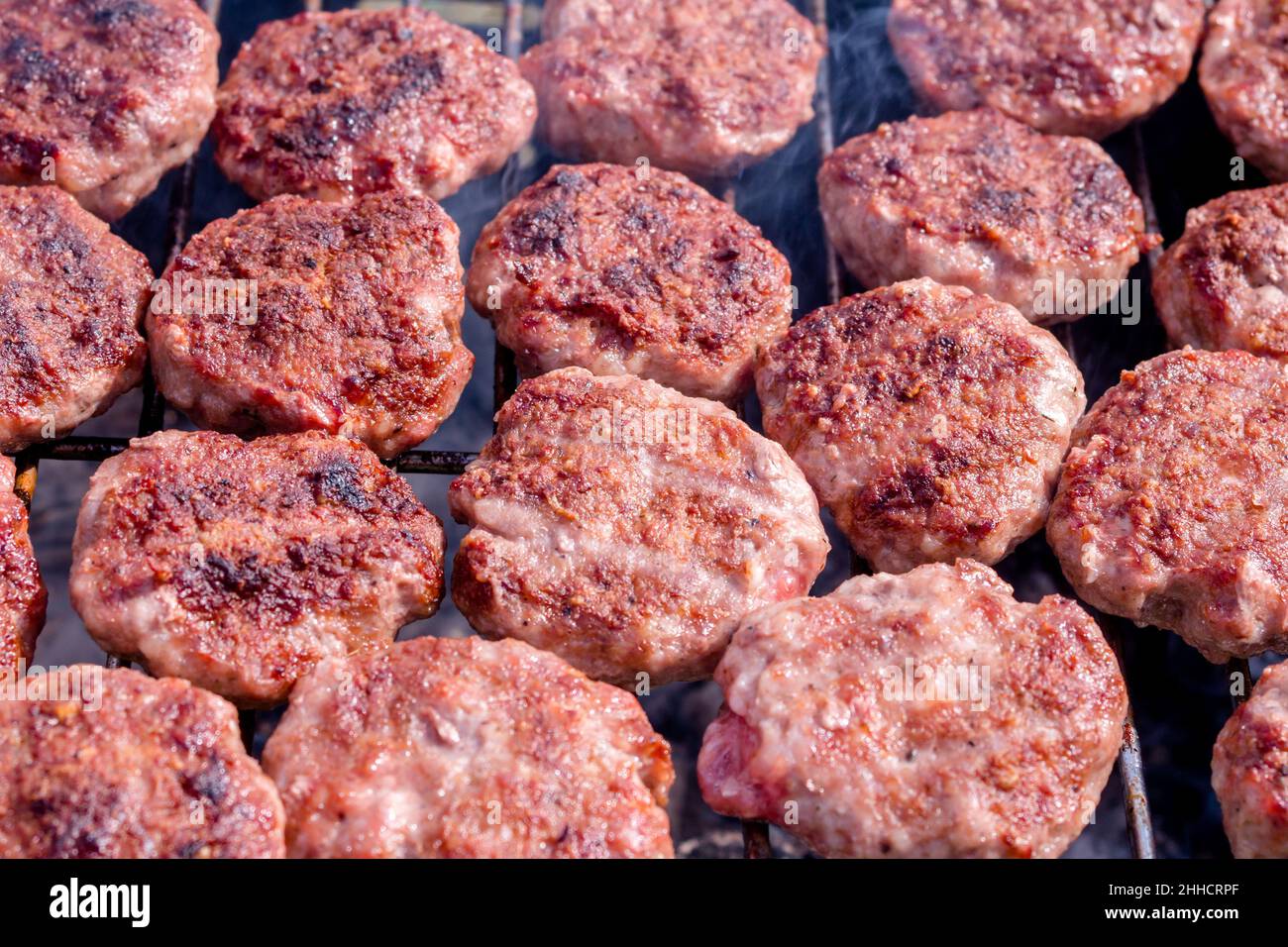 Grilling meatballs on the grill. Cooking  barbeque with charcoal in garden. Turkish cuisine. Stock Photo