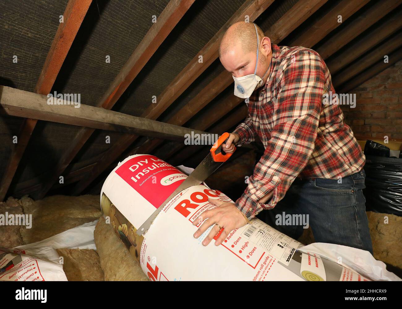 File photo dated 14/11/17 loft insulation being fitted. David Cameron's promise in 2013 to 'cut the green crap' will cost millions of households around £170 each when energy prices spike this spring, a new report has claimed. Issue date: Monday January 24, 2022. Stock Photo