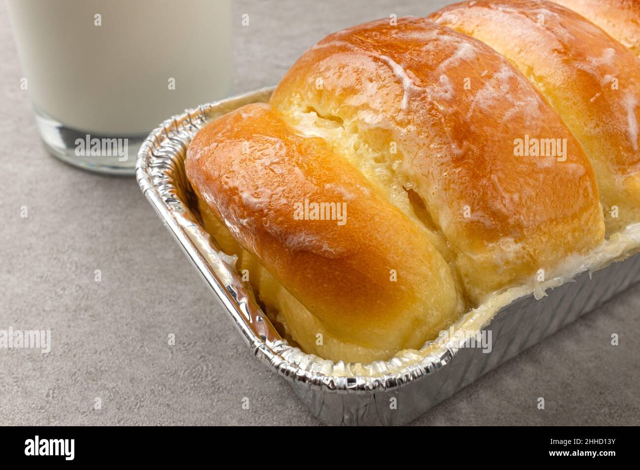 Wellbaked bread coated with condensed milk Stock Photo Alamy