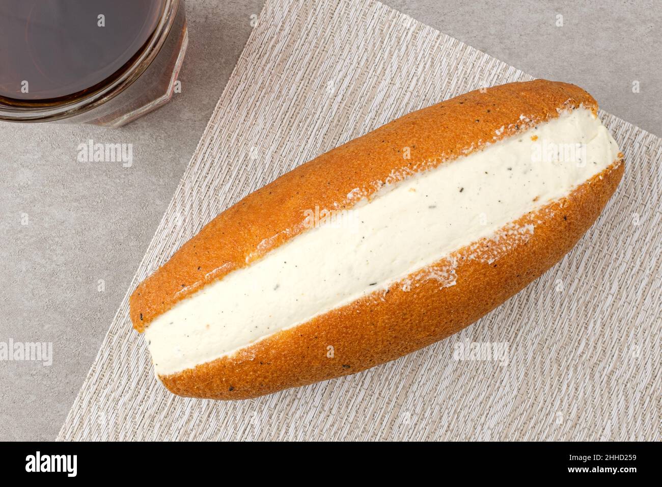 Bun with a lot of sweet cream Stock Photo