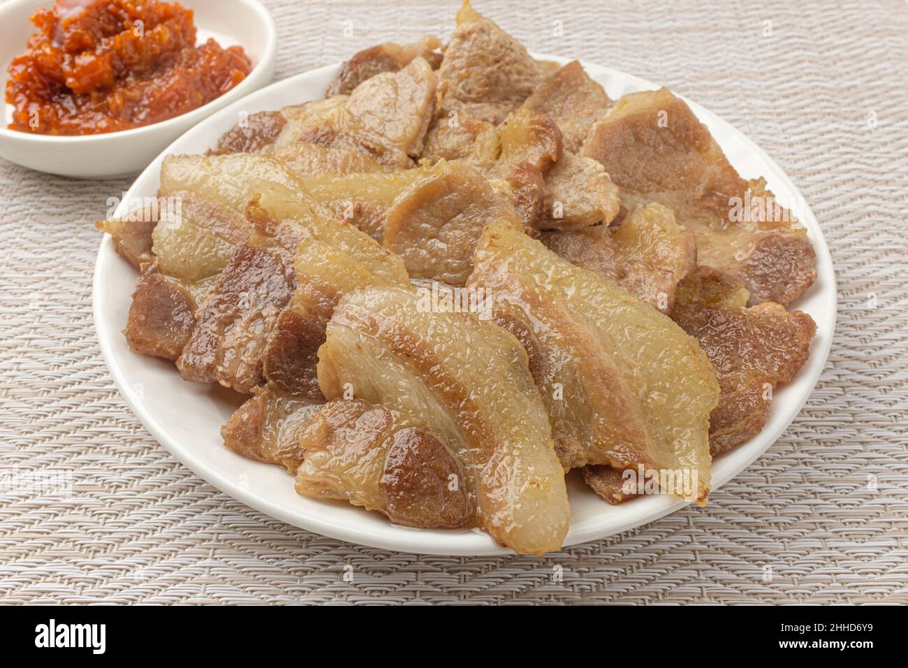 Foods high in fat and protein. Roasted pork chop. Thinly sliced pork neck Stock Photo
