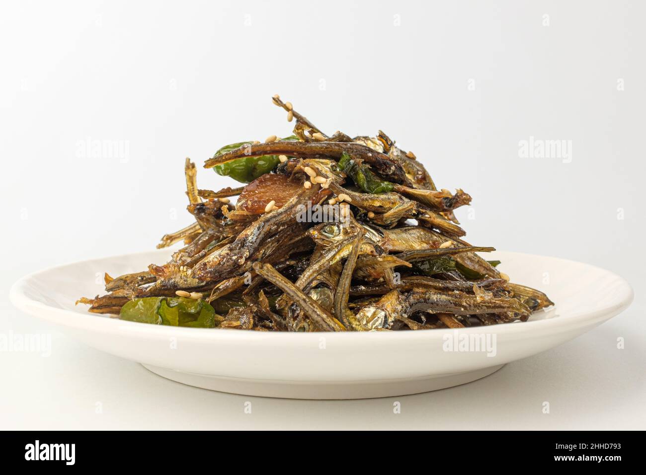 Stirfried anchovies on white background Stock Photo Alamy
