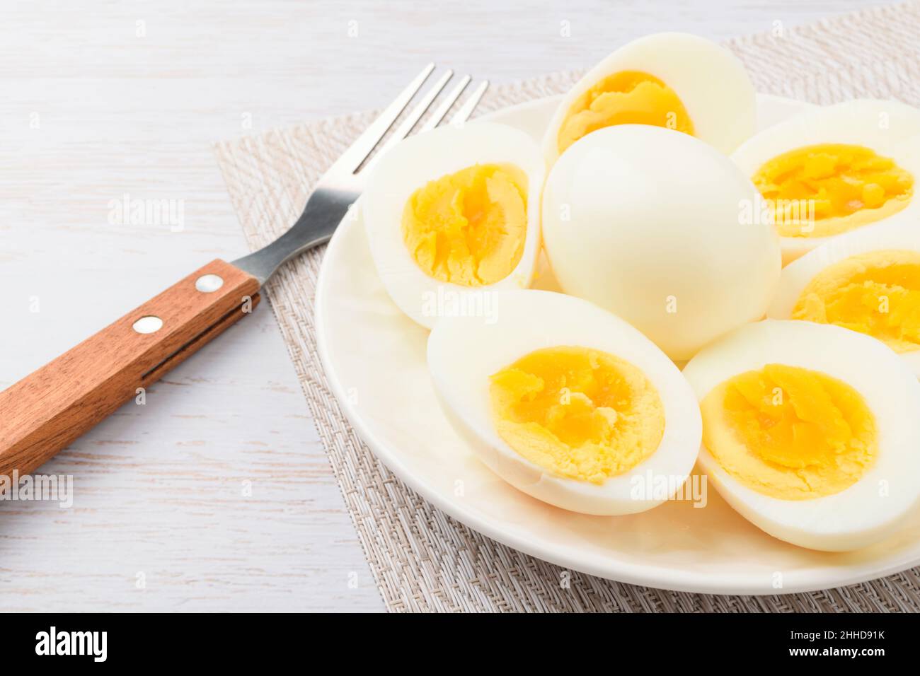 Round egg boiled in water Stock Photo Alamy