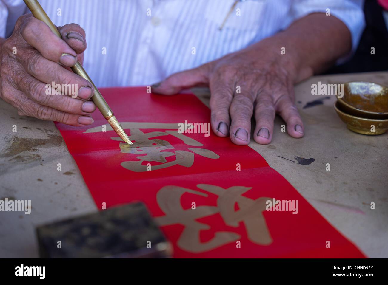 People write Spring Festival couplets with brushes to celebrate Chinese ...