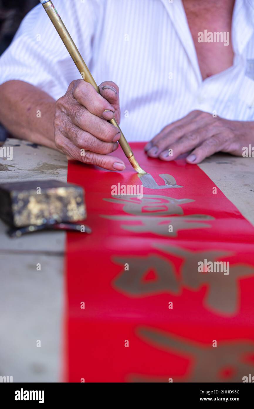 People write Spring Festival couplets with brushes to celebrate Chinese ...