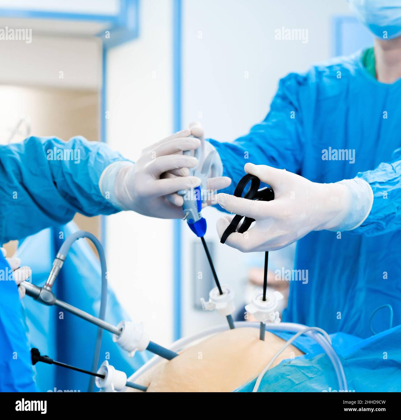 Abdominal surgery operation process using laparoscopic equipment. Selective focus. Hands of surgeons with surgical equipment. Surgical treatment of proctological diseases. Stock Photo