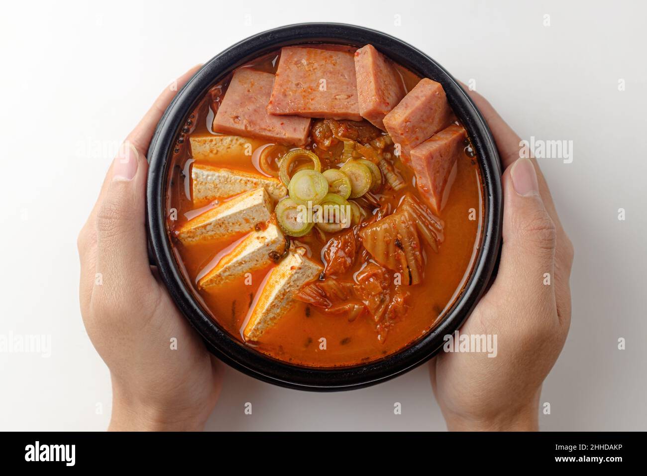 Korean signature Kimchi Stew in a hot ceramic pot served with other side  dishes Stock Photo - Alamy