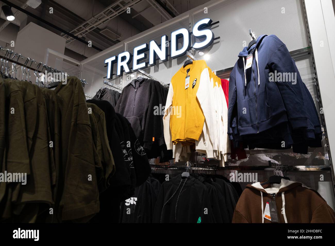 sale in a stylish clothing store for young guys Stock Photo Alamy