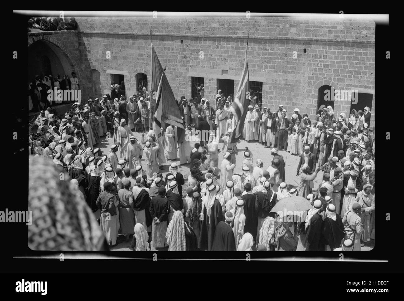 Moslem (i.e., Muslim) celebrations at Mejdal (Wady Nemill and Sey'd Hussein Shrine at Ascalon) and at Gaza (el Muntar) April 20th, 21st and 22nd 1943. The procession in open courtyar 1132 by Bain News Stock Photo