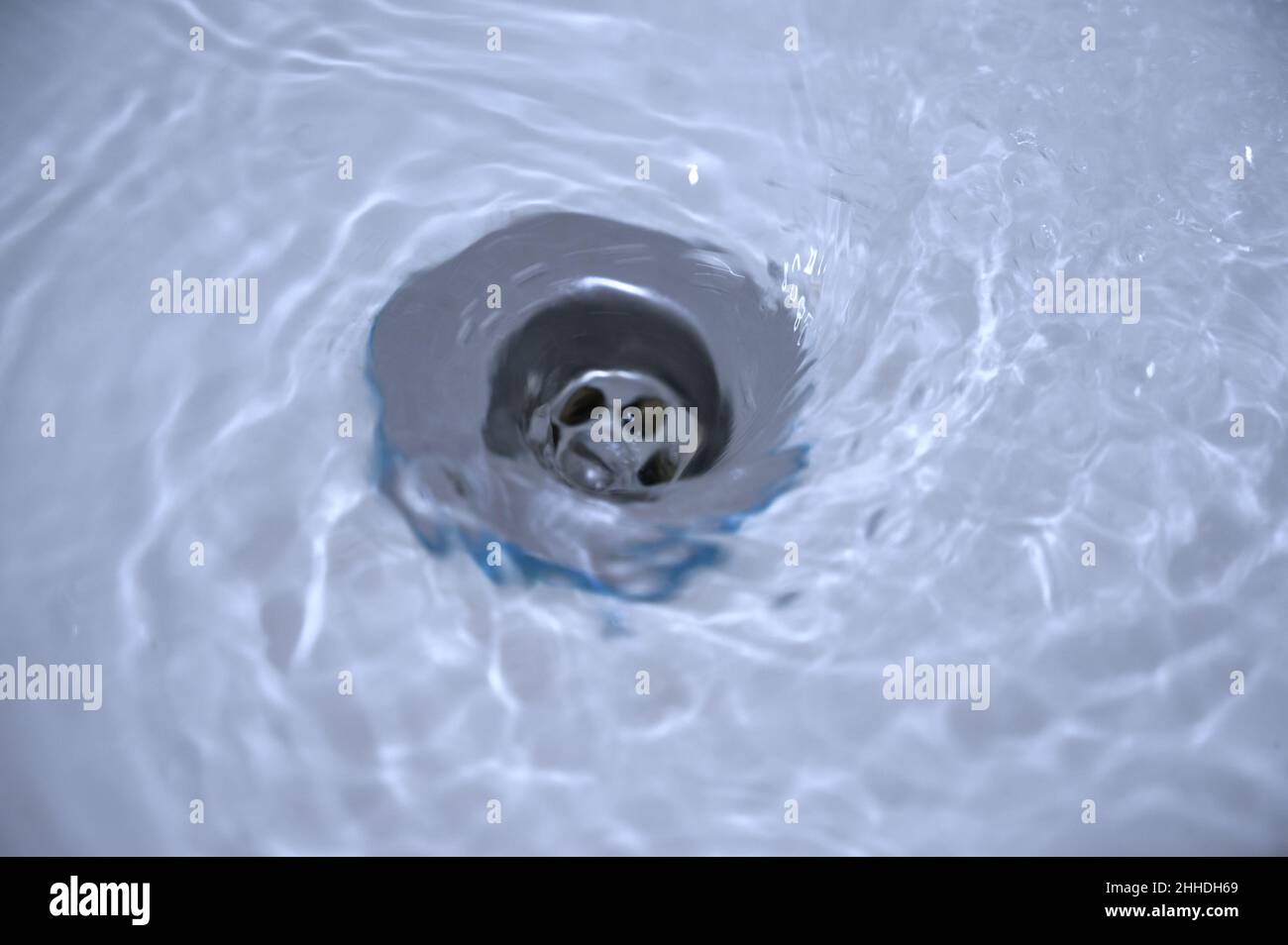 Water flowing down the hole in a kitchen sink Stock Photo Alamy