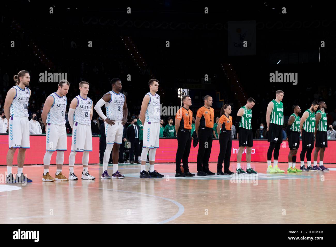 Seville, Spain. 23rd Jan, 2022. The players of Coosur Real Betis and Surne Bilbao Basket seen during a minute of silence before the Liga ACB match between Coosur Real Betis and Surne Bilbao Basket at San Pablo Sports Center in Seville. (Photo credit: Mario Diaz Rasero Credit: Gonzales Photo/Alamy Live News Stock Photo