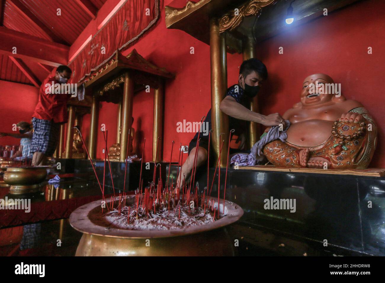 the tradition of cleaning altars and statues of gods at the Buddhist Dharma & 8 Pho Sat monastery welcoming the Chinese New Year in Bogor, Indonesia Stock Photo