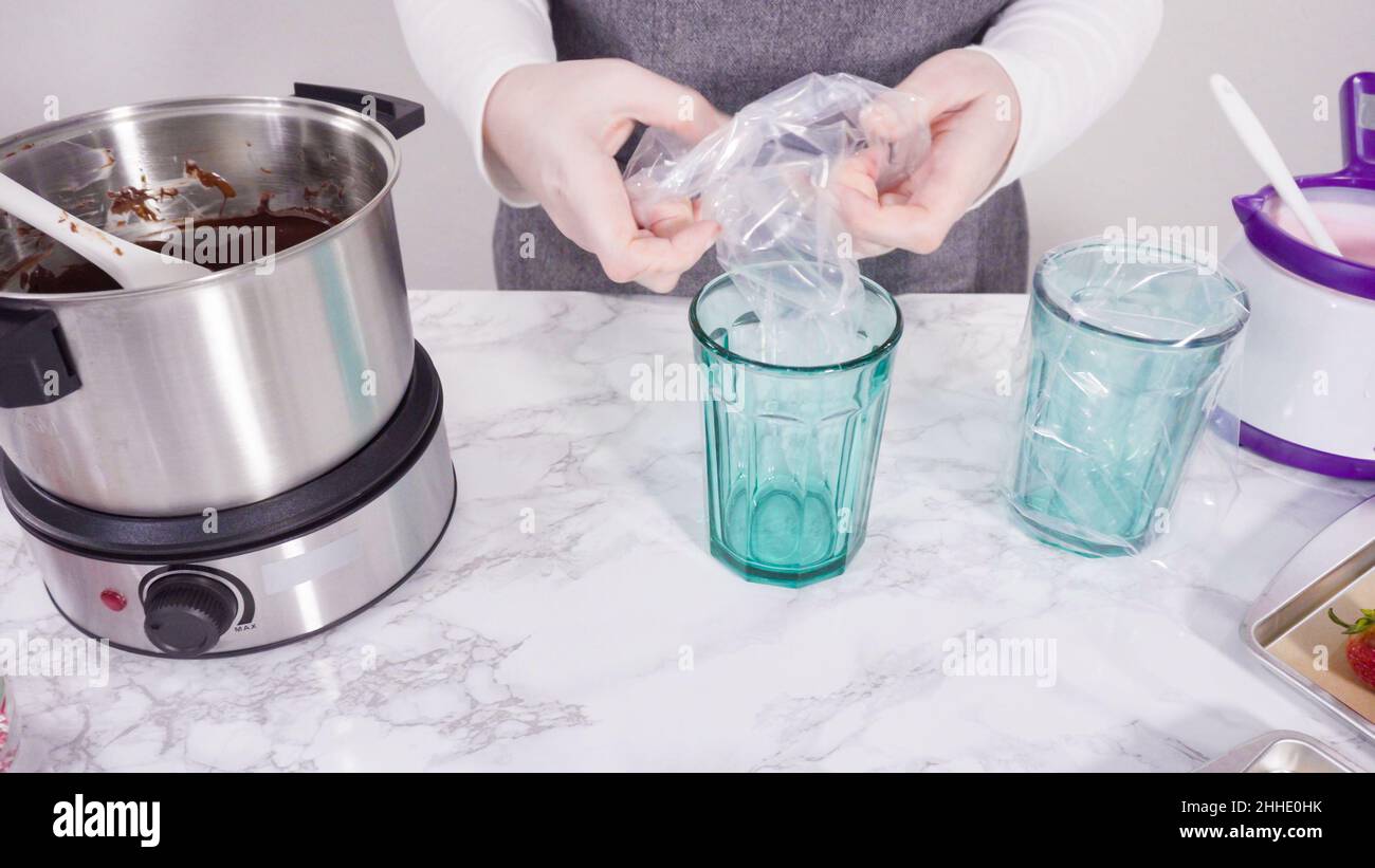 Step by step. Melting chocolate chips in chocolate melting pots Stock Photo Alamy