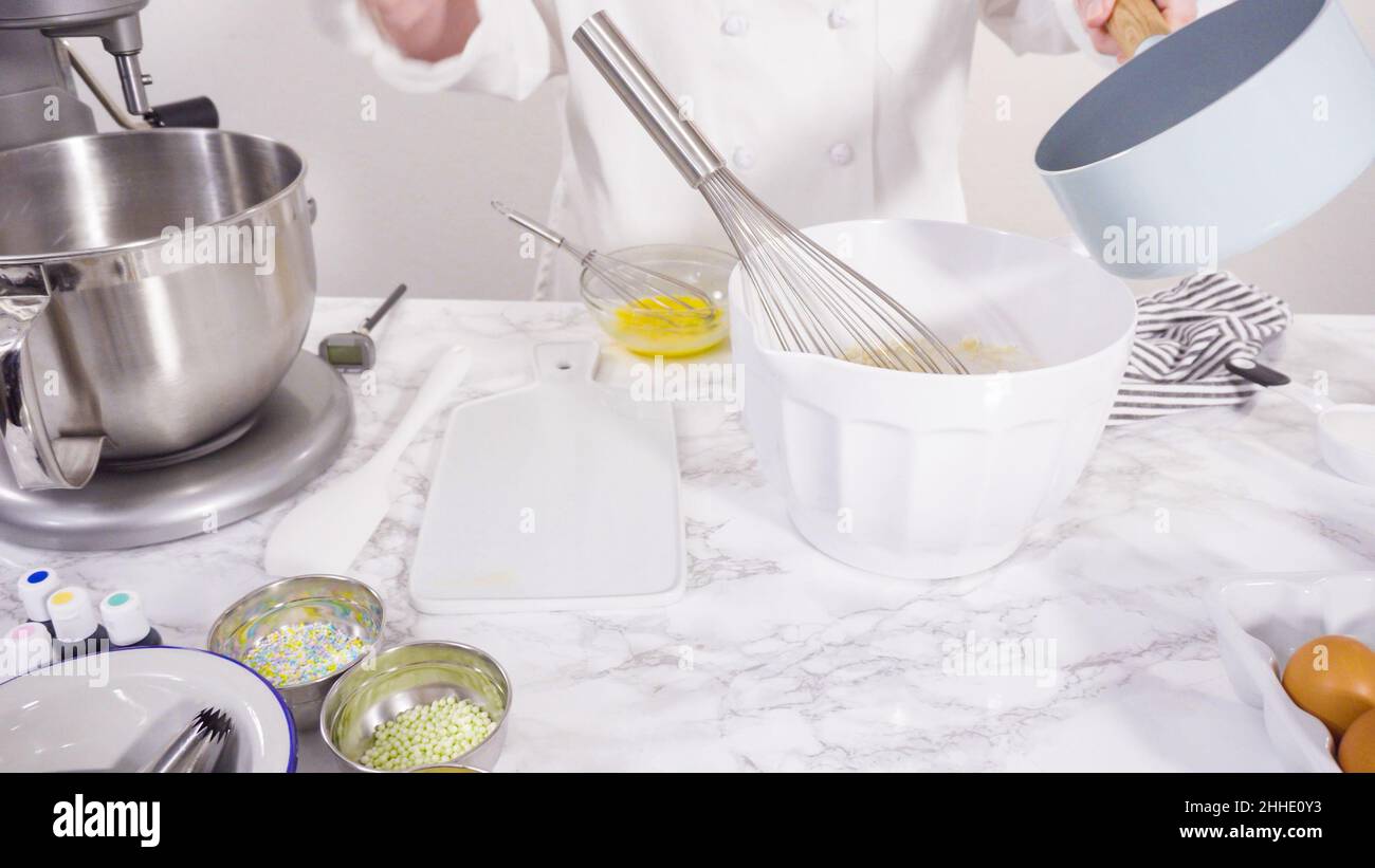 Mixing ingredients to bake sheet cake with Italian buttercream frosting