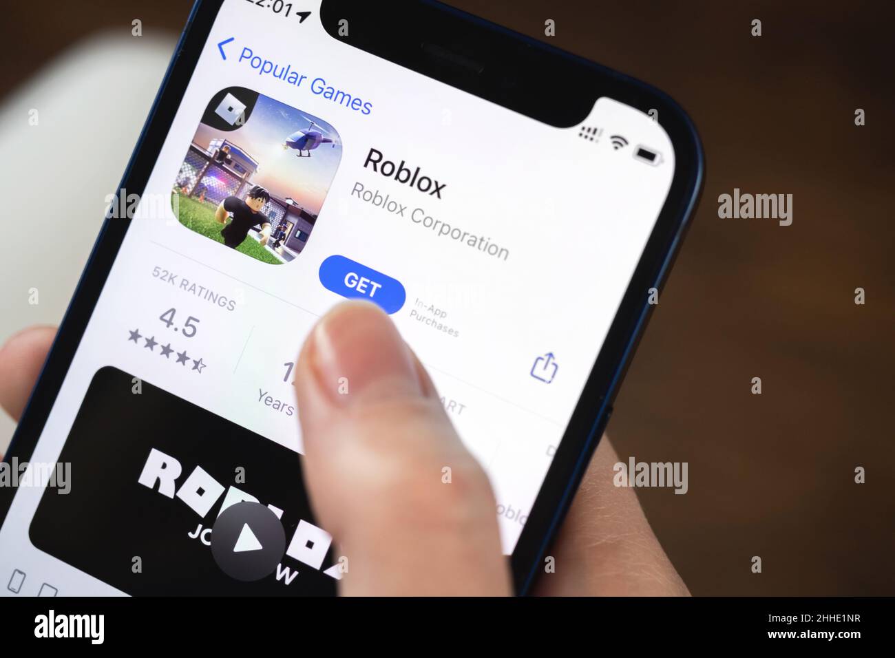 In this photo illustration the Roblox logo is seen on a smartphone screen  in front of Roblox website. (Photo by Pavlo Gonchar / SOPA Images/Sipa USA  Stock Photo - Alamy