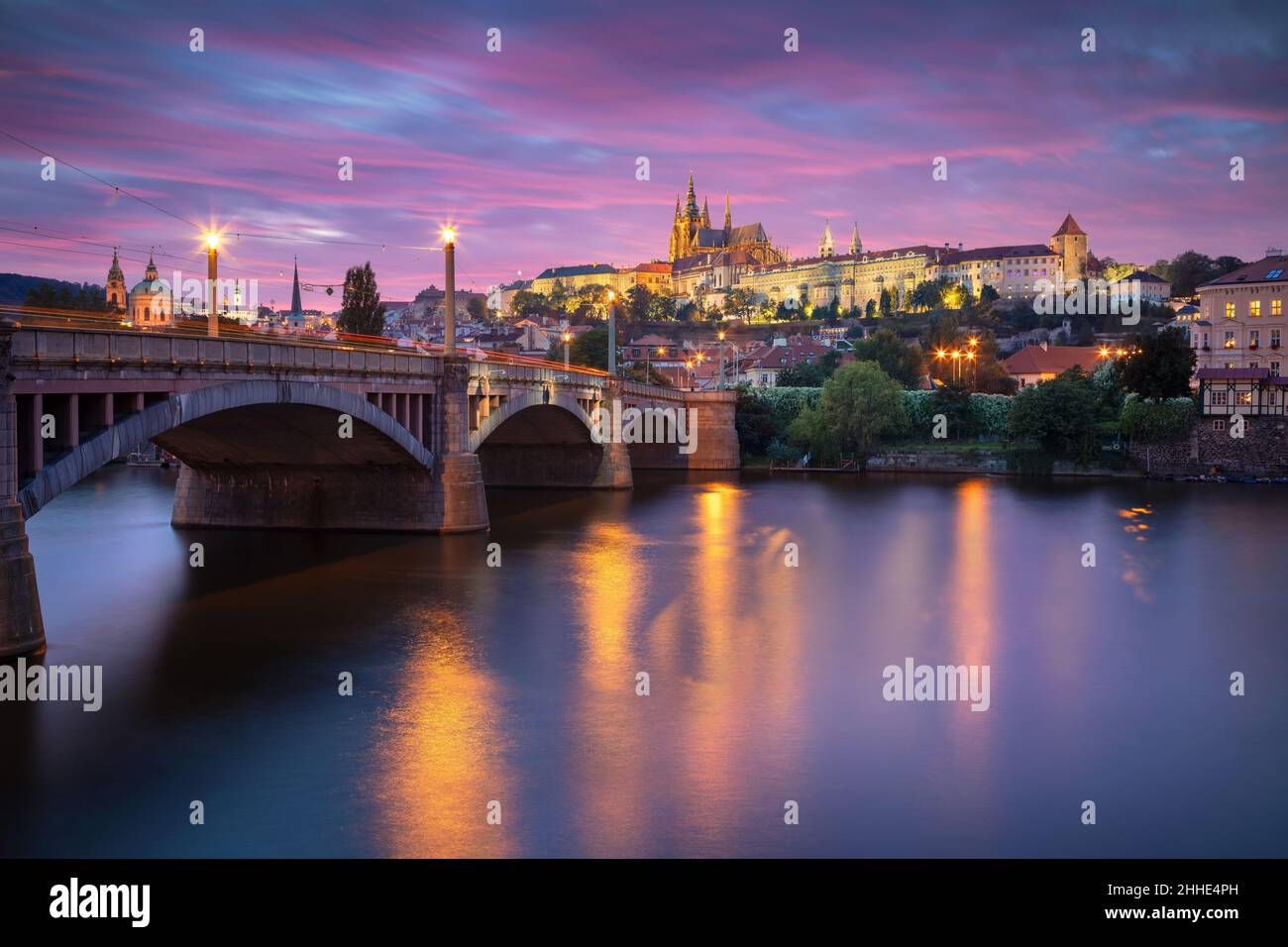 Prague, Czech Republic. Cityscape image of Prague, capital city of Czech Republic with St. Vitus Cathedral and the Charles Bridge over Vltava River at Stock Photo