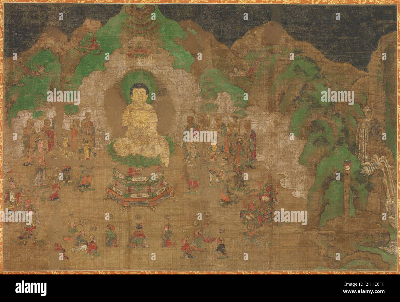Life of the Buddha: King Bimbisara's Conversion early 15th century Japan After Shakyamuni, the historical Buddha, was enlightened, he became a wandering teacher, delivering the message that life is suffering from which one can be released through spiritual cultivation and compassionate behavior toward all living things. This painting, from a set of eight depicting milestones in the life of the Buddha, illustrates the conversion of King Bimbisara at Vulture Peak. The Buddha is shown in deified form seated on a lotus pedestal, with his right hand raised in the gesture that indicates teaching. Th Stock Photo