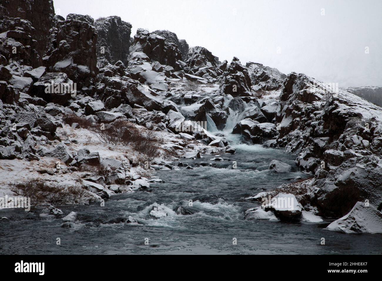Rocky mountain stream in winter copy space Stock Photo