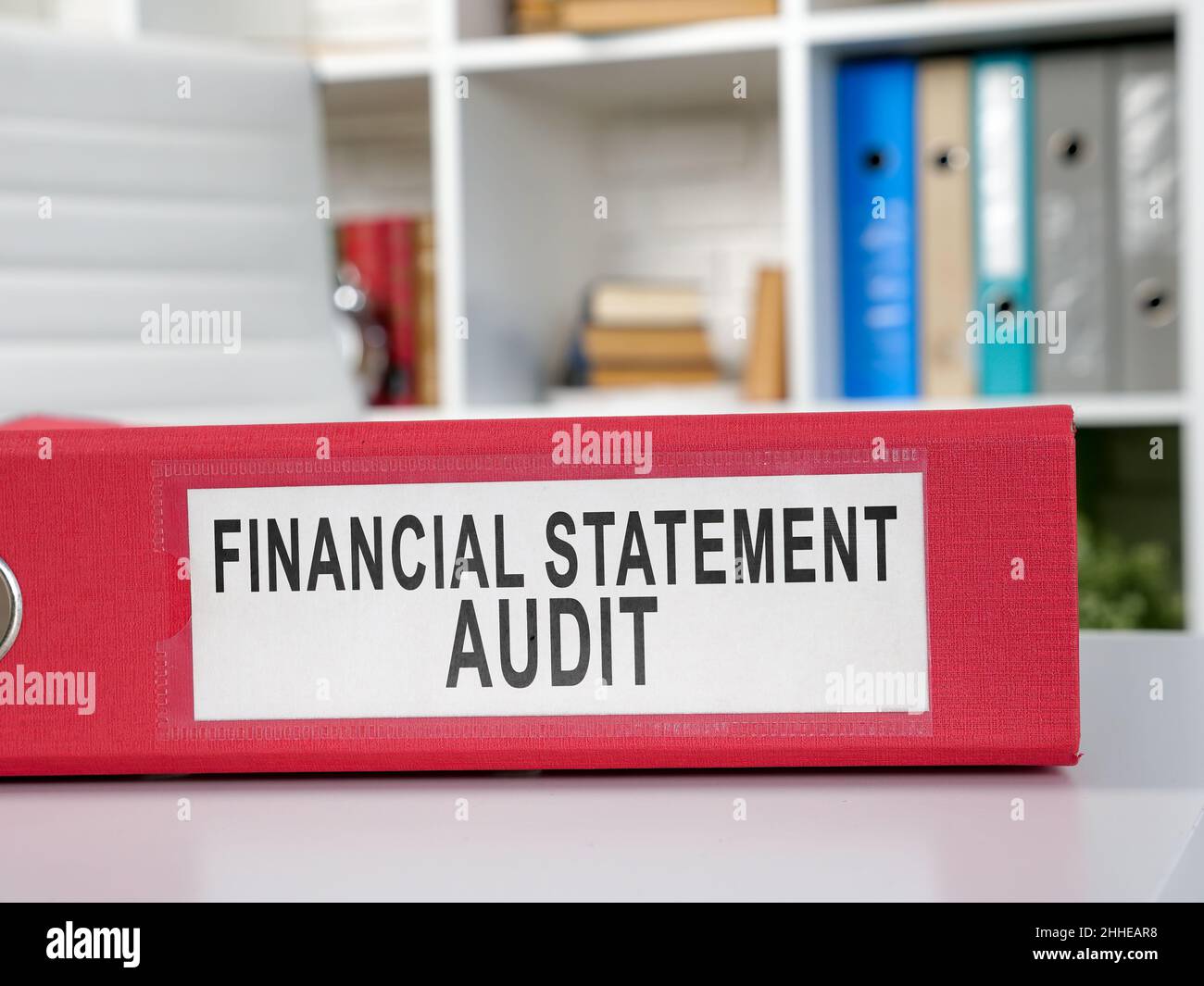 Red folder financial statement audit on the desk. Stock Photo