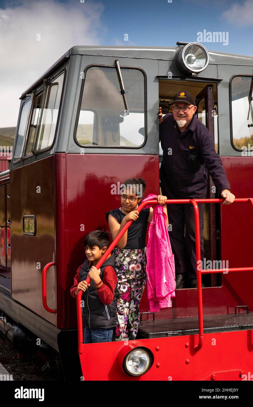 UK, Wales, Merthyr Tydfil, Brecon Mountain Railway, Torpantau, children on diesel locomotive with driver Stock Photo