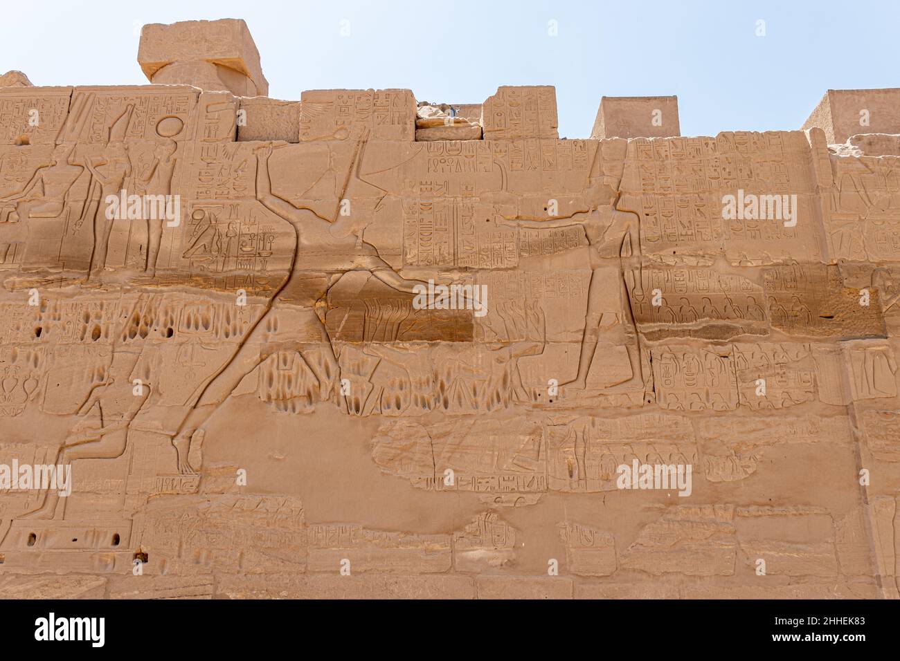 Ancient egyptian hieroglyphs carved on the stone wall in the Karnak ...
