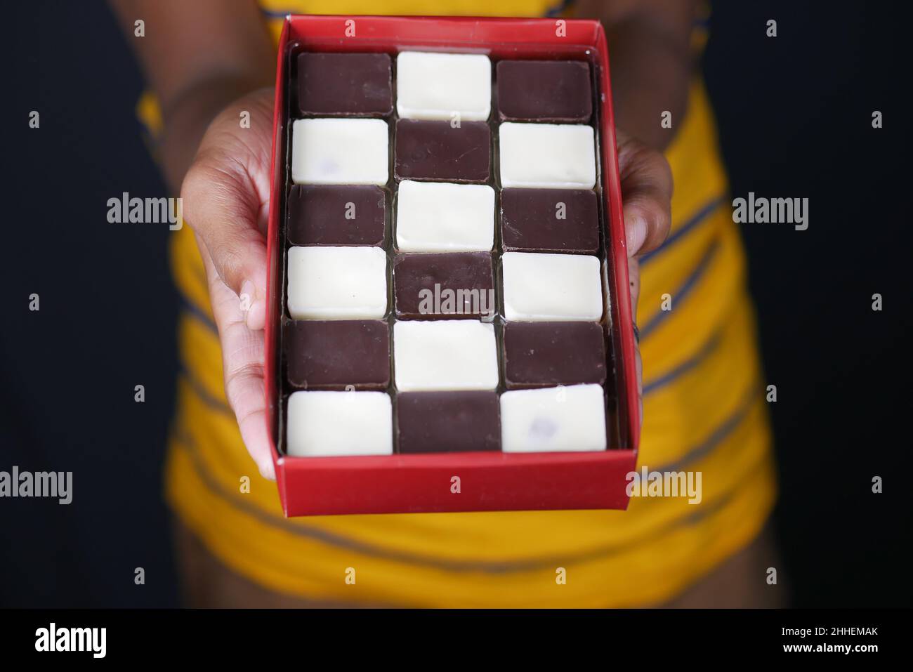 holding a box on candy chocolate close up  Stock Photo