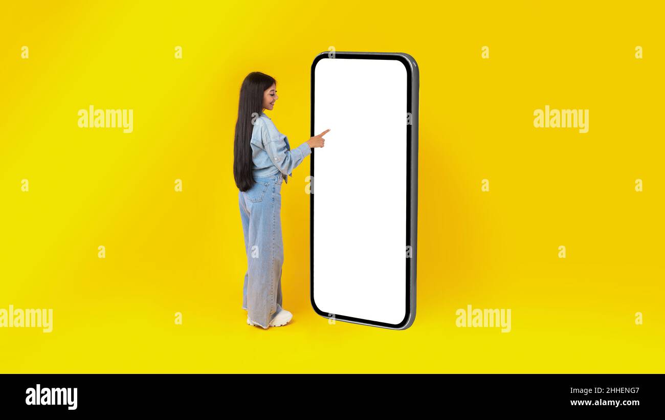 Woman using white empty smartphone screen panel Stock Photo
