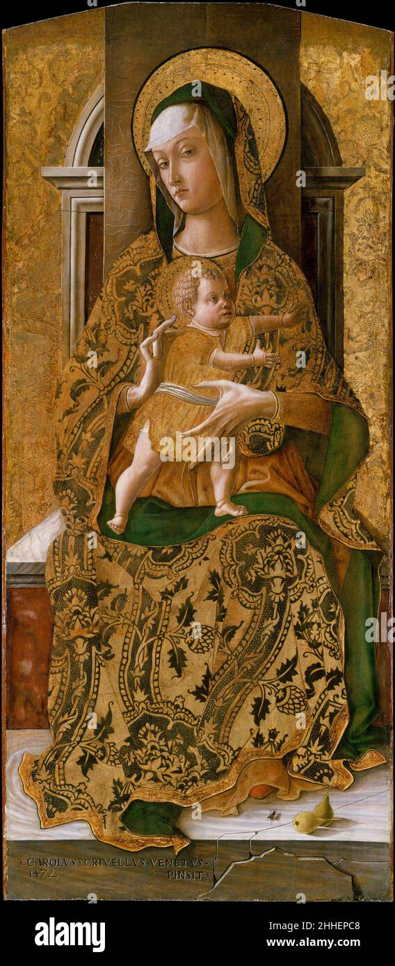 Madonna and Child Enthroned 1472 Carlo Crivelli Italian These three panels are from an altarpiece painted for a Dominican church in the Marchigian town of Ascoli Piceno. It is possible that the child was originally shown reaching for a flying bird, his frequent attribute. The cracked marble dais is a recurrent feature of Crivelli's work. On it are two pears, symbolic of the Fall of Man, and a fly, conceivably an emblem of Satan. Crivelli loved visual tricks, and the shadow cast by the fly gives a disturbingly realistic quality.Saint George (fourth century) is shown in contemporary, fifteenth-c Stock Photo