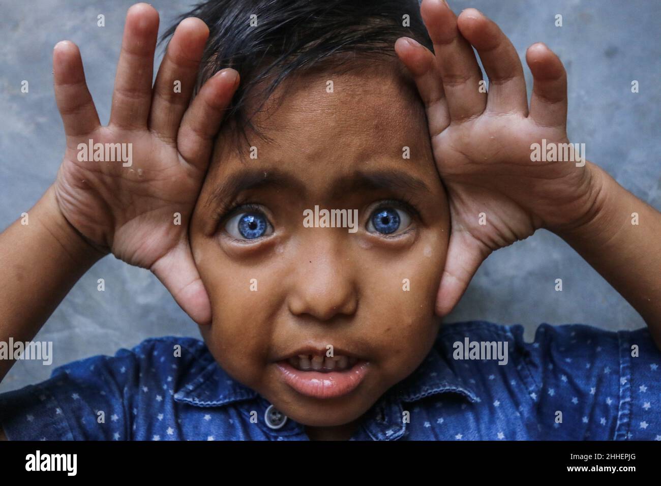 A 4 year old baby is gifted with light sky blue eyeballs. Apart from blue  eyes, he also has sixth sense vision Stock Photo - Alamy