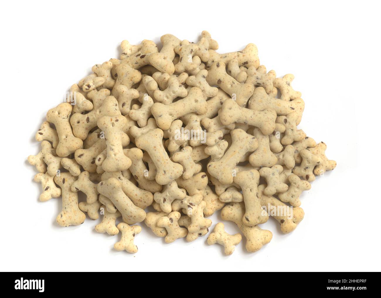 pile of heathy bone shaped dog and puppy biscuits treats  used for training and occasions on a white isolated background  macro shot Stock Photo
