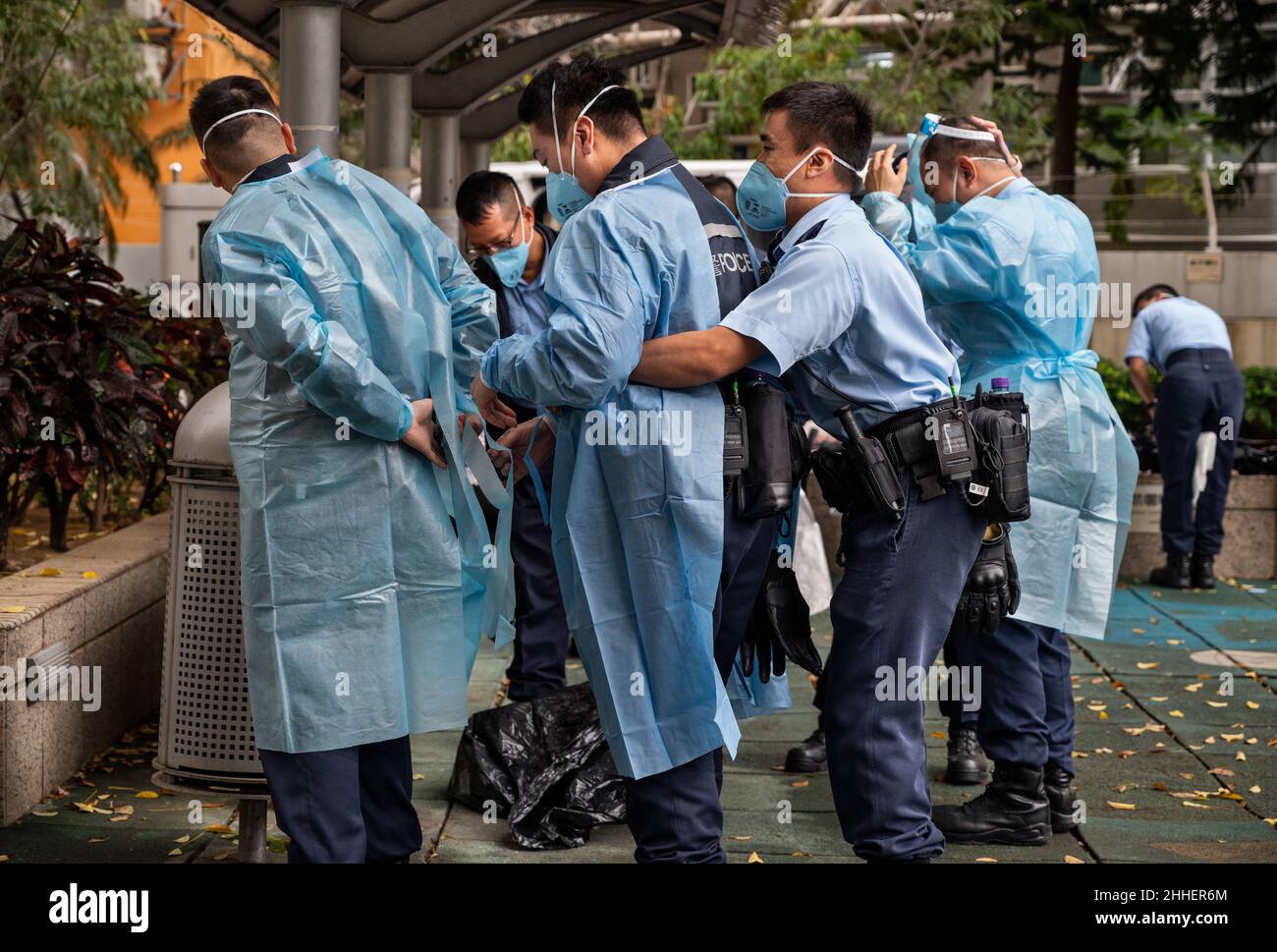 Ppe In Police Police officers wearing personal protective equipment (PPE) outside a ...