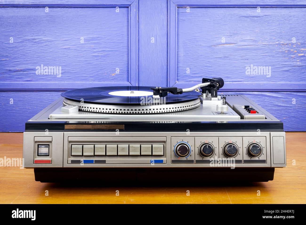 Vintage turntable vinyl record player with black vinyl on a table Stock ...