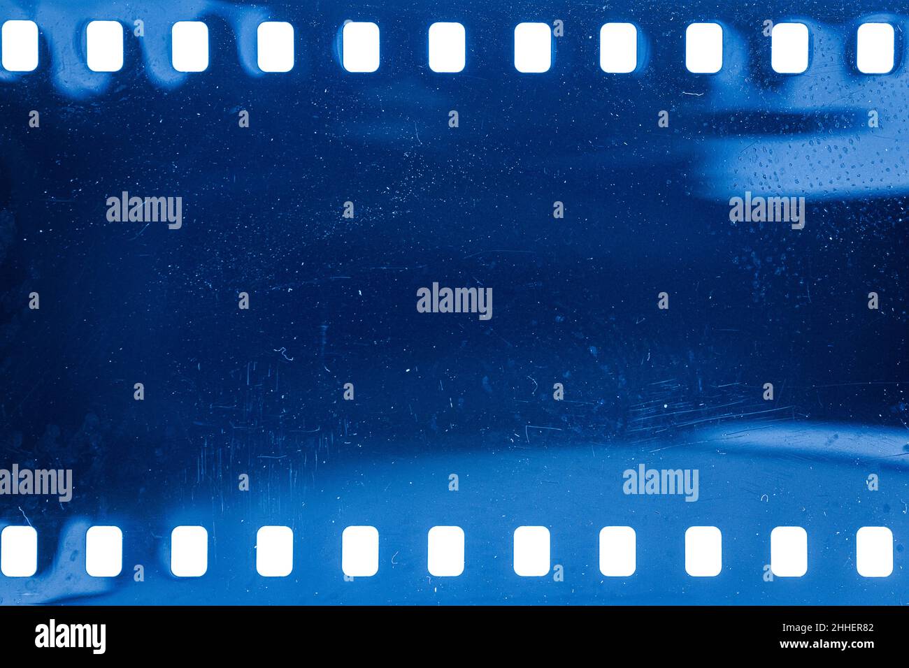 Dusty and grungy 35mm film texture or surface. Perforated scratched ...