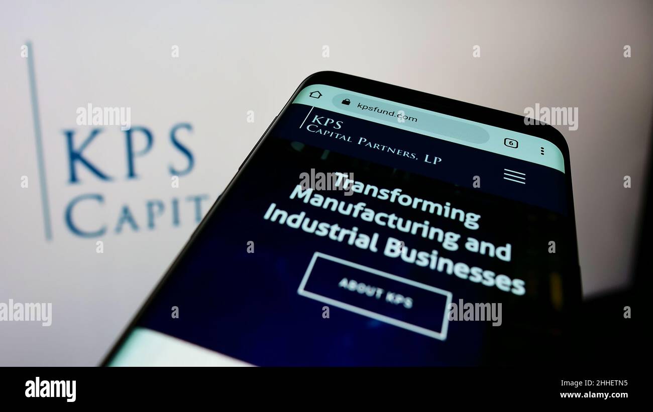 Smartphone with website of US investment company KPS Capital Partners LP on screen in front of business logo. Focus on top-left of phone display. Stock Photo