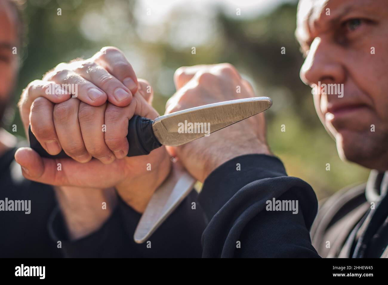 Knife vs knife fight. Kapap instructors demonstrates sombrada drill