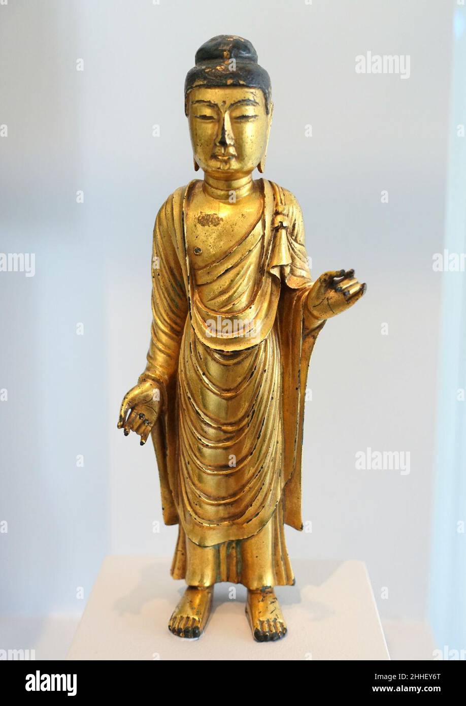 Standing Buddha with Right Hand Lowered and Left Hand Raised, Korea, Unified Silla dynasty, late 7th to early 8th century AD, gilt bronze Stock Photo