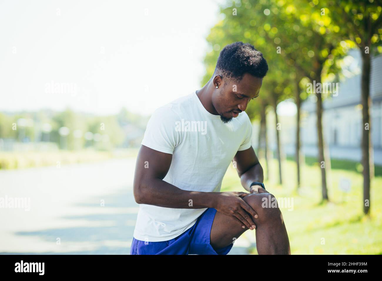 The man has severe pain in the knees and leg muscles after training and