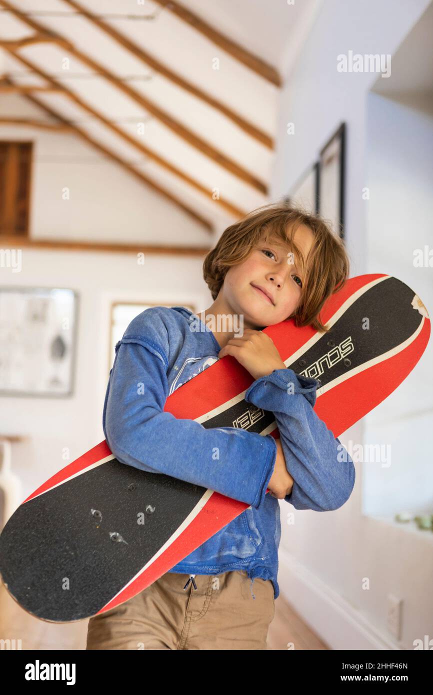portrait of 8 year old boy with skateboard Stock Photo